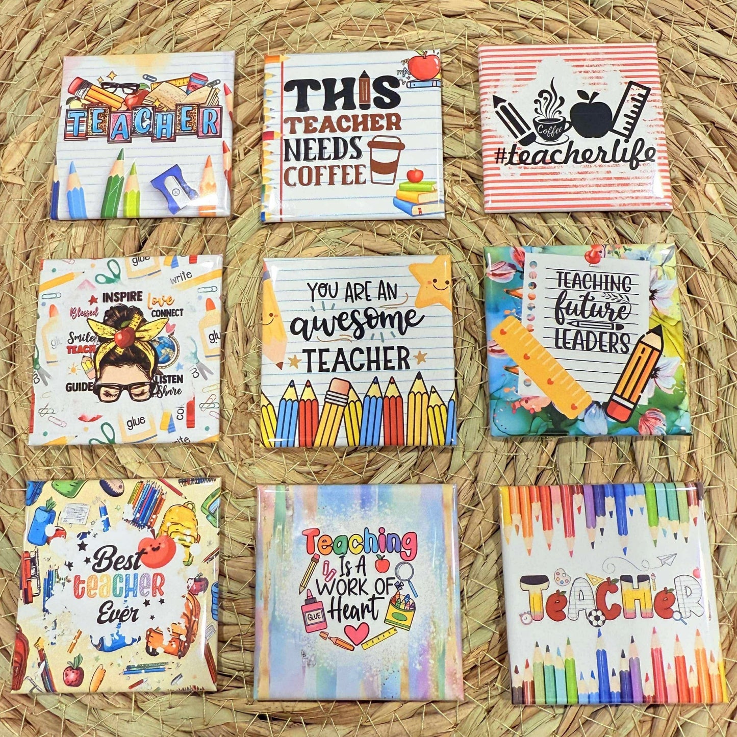 Set of colorful coasters with teacher-themed designs on a woven surface