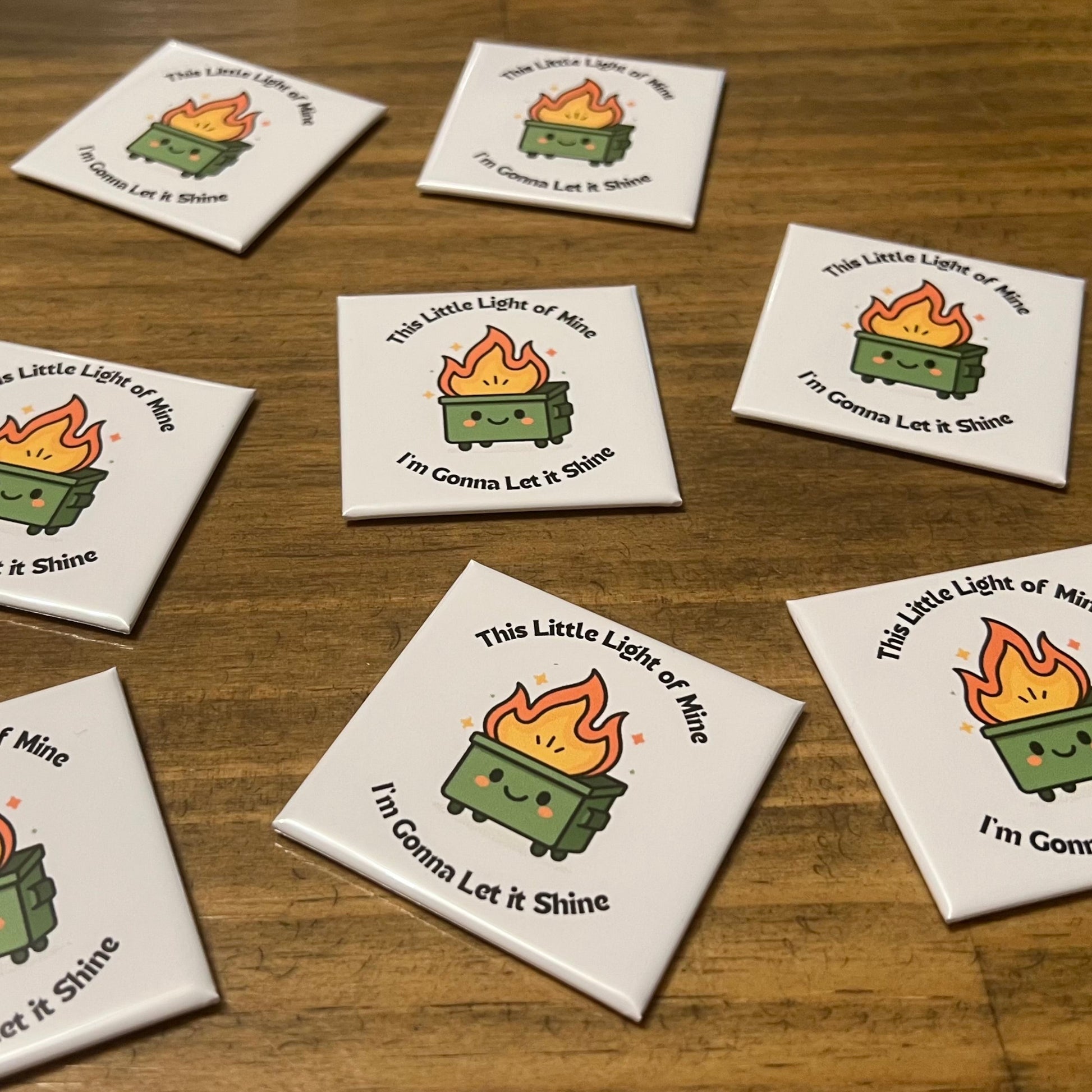 Set of eight coasters with a design of a green lantern and text on a wooden surface