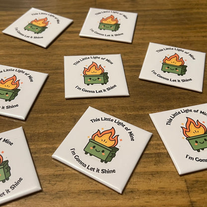 Set of eight coasters with a design of a green lantern and text on a wooden surface